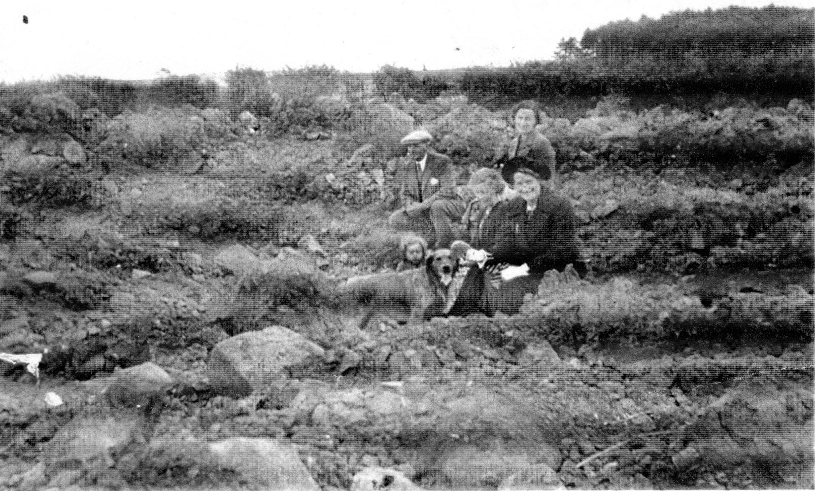 Ross family sitting in the Traprain mine crater.jpeg